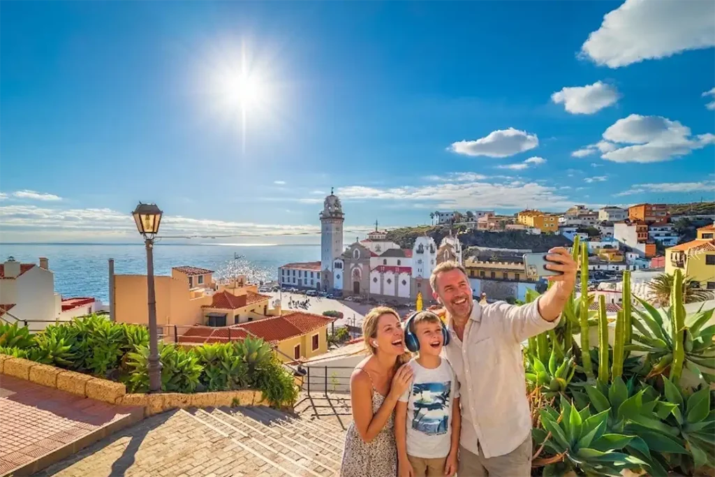 A family enjoying an immersive audio experience in Candelaria, overlooking the Basilica – Tenerife