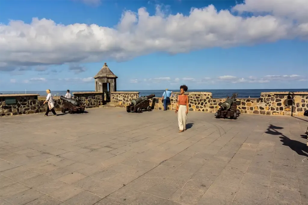 A traveller amongst the canyons of Plaza de Europa, Puerto de la Cruz, Tenerife